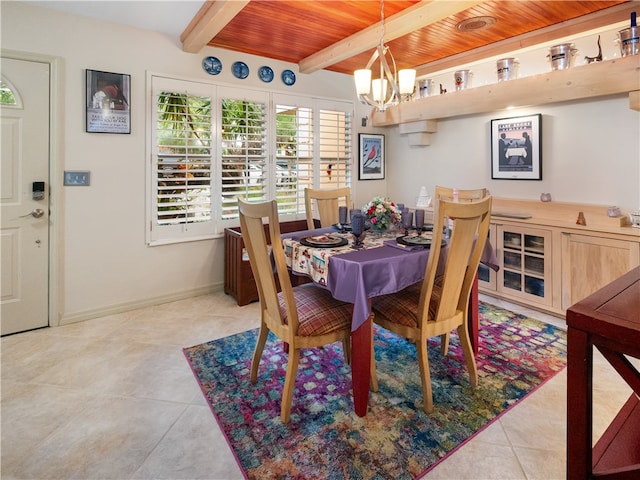 tiled dining area featuring beamed ceiling, wood ceiling, and an inviting chandelier