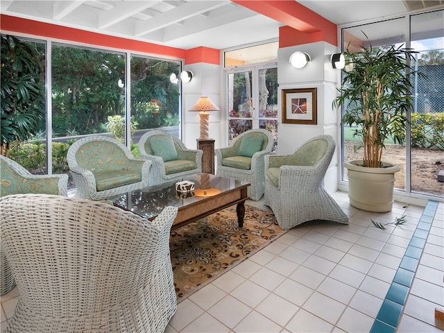 sunroom / solarium featuring beamed ceiling