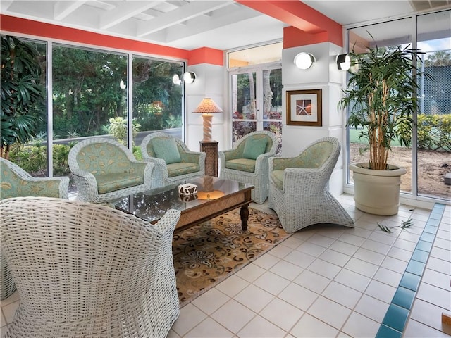 1308 Coral Park Ln Unit 104, Vero Beach, FL 32963 - sunroom / solarium featuring tile patterned floors and beamed ceiling