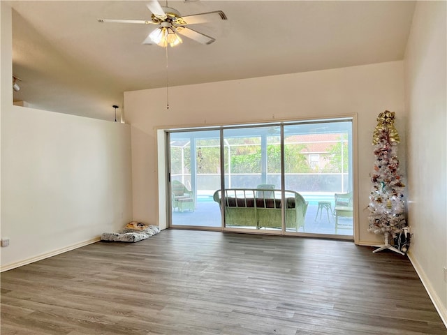 unfurnished room with hardwood / wood-style flooring and ceiling fan