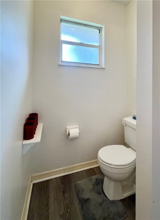 bathroom featuring toilet and hardwood / wood-style flooring