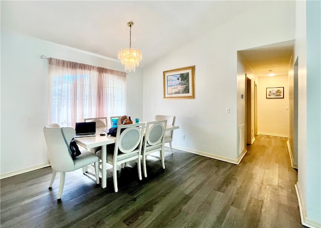 dining area featuring lofted ceiling, an inviting chandelier, and dark wood-type flooring