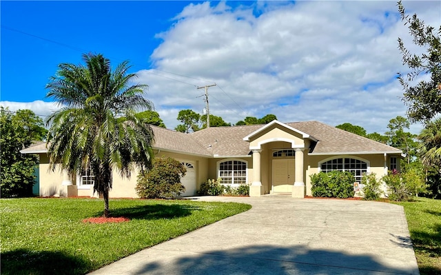 ranch-style home featuring a front lawn