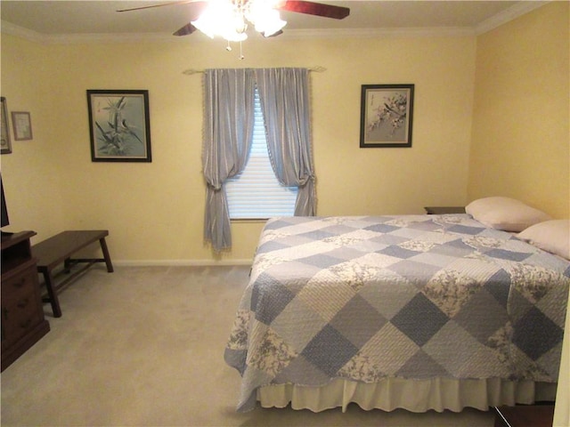 bedroom featuring light colored carpet, crown molding, baseboards, and ceiling fan