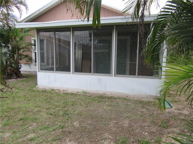 308 14th Pl SW, Vero Beach, FL 32962 - view of side of home featuring a sunroom