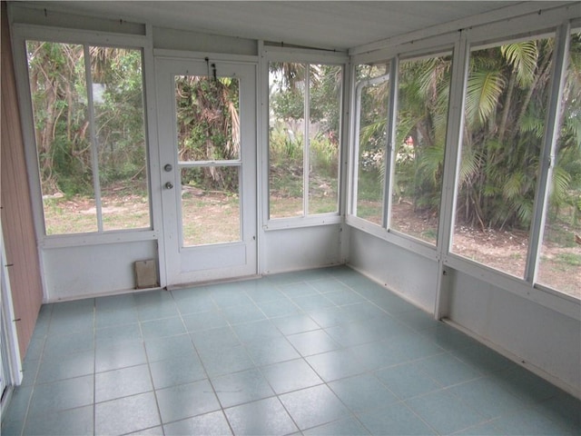 unfurnished sunroom featuring a wealth of natural light