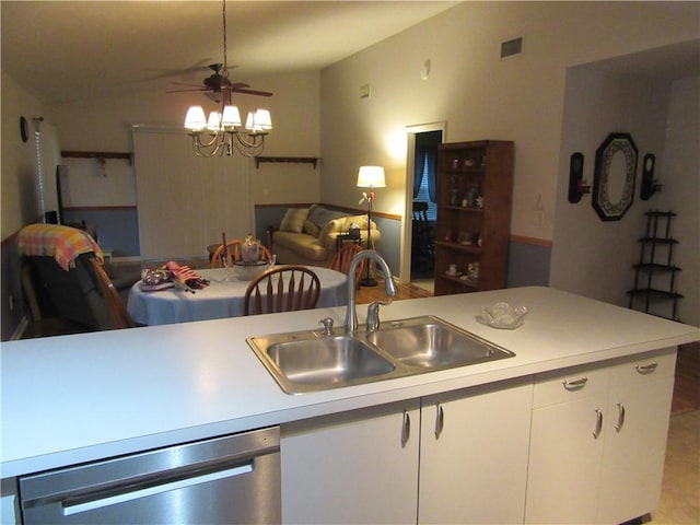 308 14th Pl SW, Vero Beach, FL 32962 - kitchen featuring light countertops, stainless steel dishwasher, open floor plan, white cabinetry, and ceiling fan