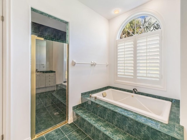 full bath with tile patterned floors, a stall shower, a bath, and vanity