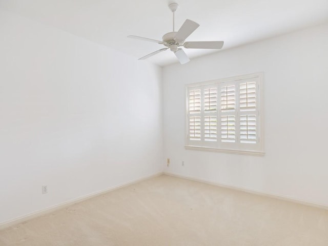 903 Holoma Dr, Vero Beach, FL 32963 - spare room with a ceiling fan, vaulted ceiling, visible vents, carpet floors, and baseboards