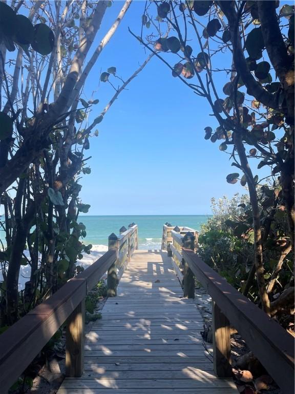 903 Holoma Dr, Vero Beach, FL 32963 - view of community featuring a water view and a view of the beach