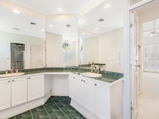 bathroom featuring an enclosed shower, vanity, tile patterned floors, and ceiling fan