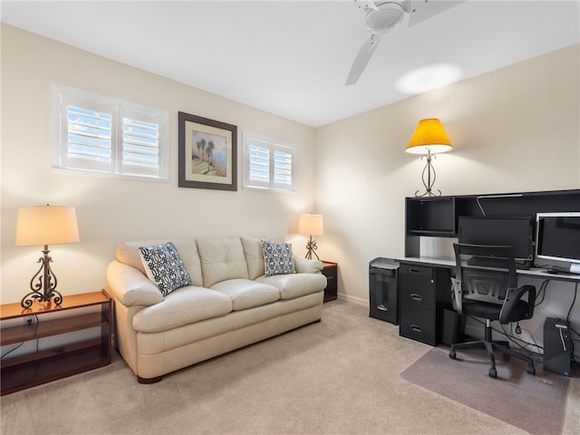 office area with light colored carpet and ceiling fan