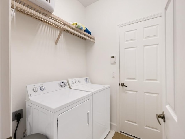 laundry area featuring independent washer and dryer