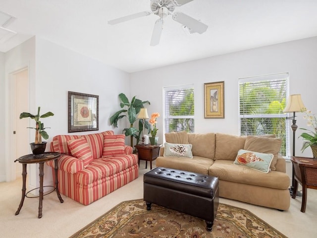 carpeted living room featuring ceiling fan