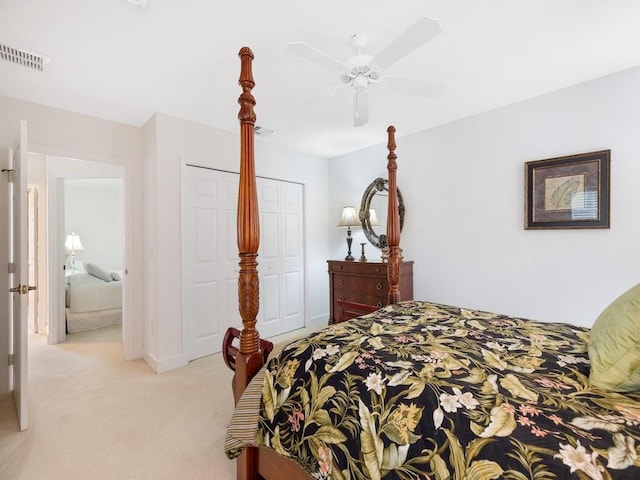 carpeted bedroom with ceiling fan and a closet