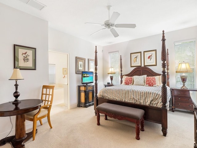 bedroom featuring ceiling fan and light carpet