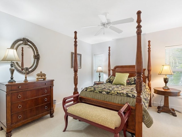 bedroom with ceiling fan and light carpet