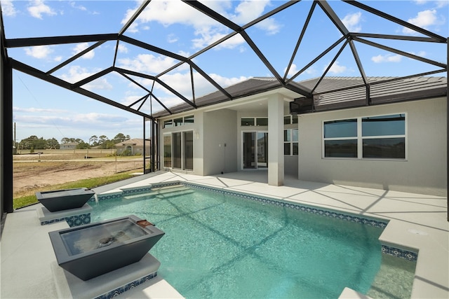 view of pool featuring a patio and a lanai