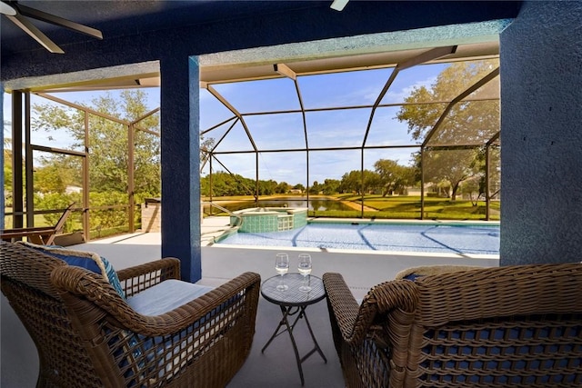 3612 2nd St SW, Vero Beach, FL 32968 - view of swimming pool featuring a ceiling fan, a pool with connected hot tub, a patio, and a lanai