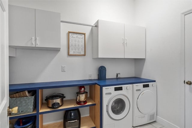 3612 2nd St SW, Vero Beach, FL 32968 - laundry area featuring cabinet space and washer and dryer
