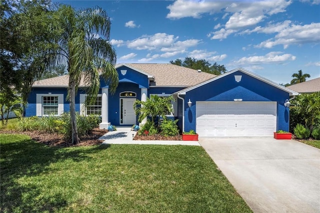 3612 2nd St SW, Vero Beach, FL 32968 - ranch-style house with a front yard, a garage, concrete driveway, and stucco siding