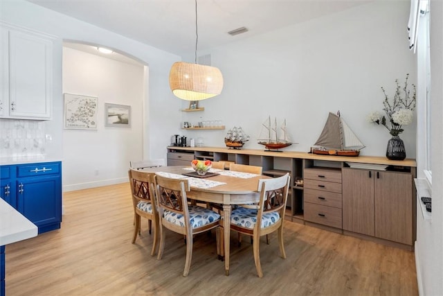 3612 2nd St SW, Vero Beach, FL 32968 - dining space with light wood finished floors and arched walkways