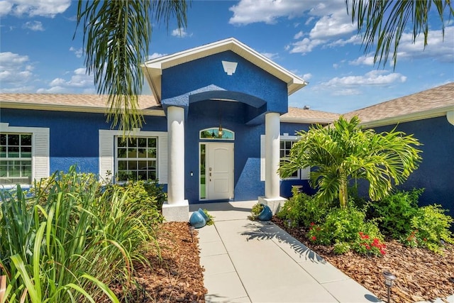 3612 2nd St SW, Vero Beach, FL 32968 - view of exterior entry featuring stucco siding