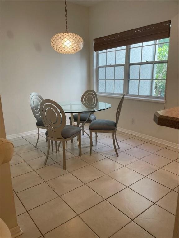 1275 Winding Oaks Cir E Unit 702, Vero Beach, FL 32963 - dining area featuring baseboards and light tile patterned floors