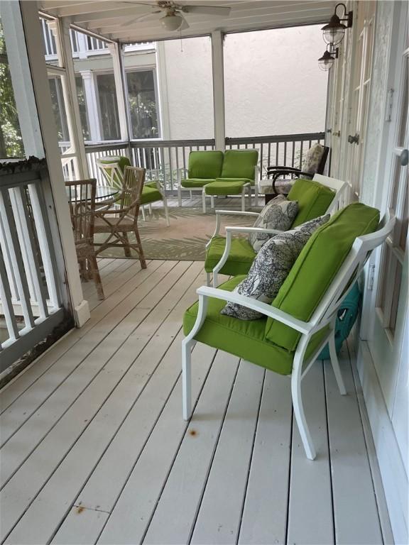 1275 Winding Oaks Cir E Unit 702, Vero Beach, FL 32963 - deck featuring ceiling fan and outdoor lounge area