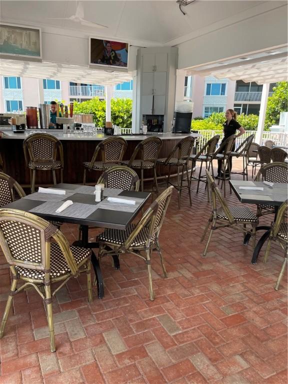 1275 Winding Oaks Cir E Unit 702, Vero Beach, FL 32963 - sunroom / solarium with healthy amount of natural light