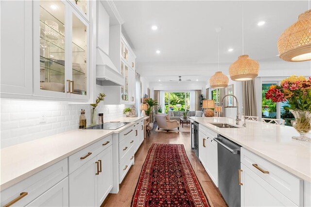 202 Strand Sq, Vero Beach, FL 32963 - kitchen with dishwasher, a sink, black electric cooktop, white cabinets, and recessed lighting