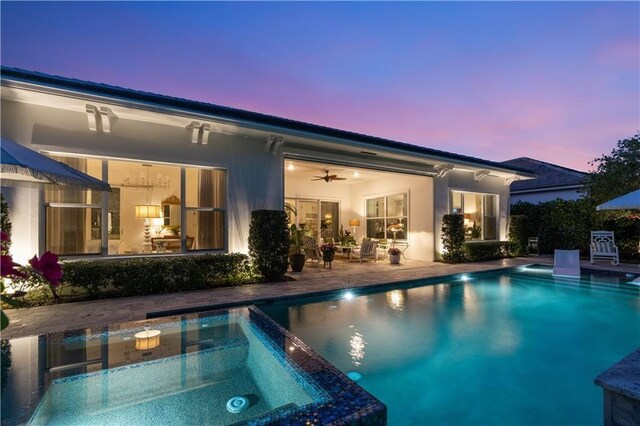202 Strand Sq, Vero Beach, FL 32963 - view of swimming pool with a patio area, a pool with connected hot tub, and ceiling fan