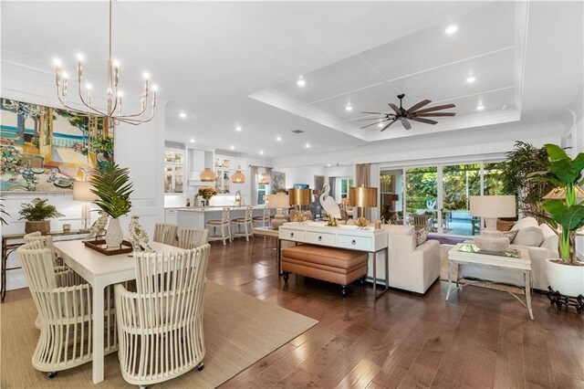 202 Strand Sq, Vero Beach, FL 32963 - living area with a tray ceiling, ornamental molding, ceiling fan, wood finished floors, and recessed lighting
