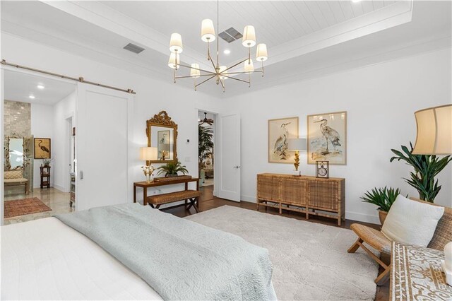 202 Strand Sq, Vero Beach, FL 32963 - bedroom with a chandelier, a barn door, recessed lighting, baseboards, and wooden ceiling