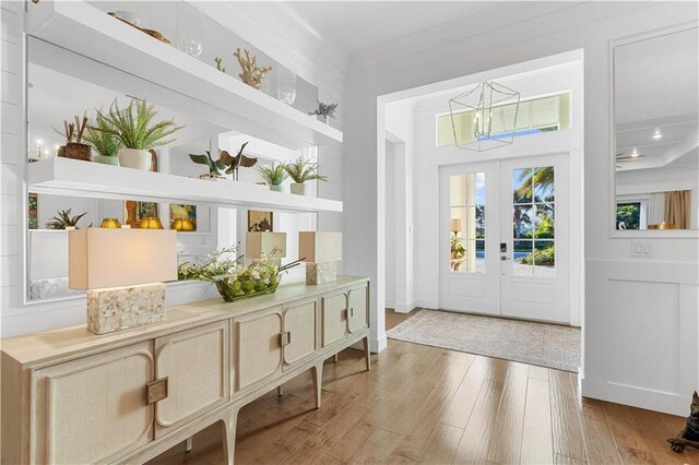 202 Strand Sq, Vero Beach, FL 32963 - foyer with a chandelier, wood finished floors, and french doors