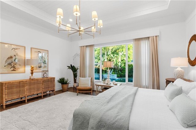 202 Strand Sq, Vero Beach, FL 32963 - bedroom featuring a chandelier and wood finished floors
