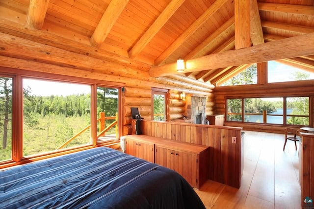 bedroom featuring hardwood / wood-style floors, high vaulted ceiling, log walls, beam ceiling, and wood ceiling