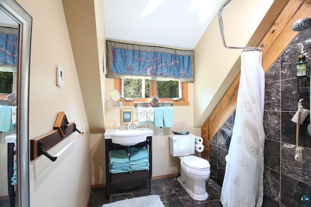 bathroom featuring tile floors, sink, and toilet