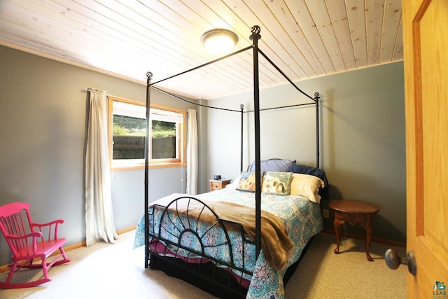 carpeted bedroom featuring wood ceiling