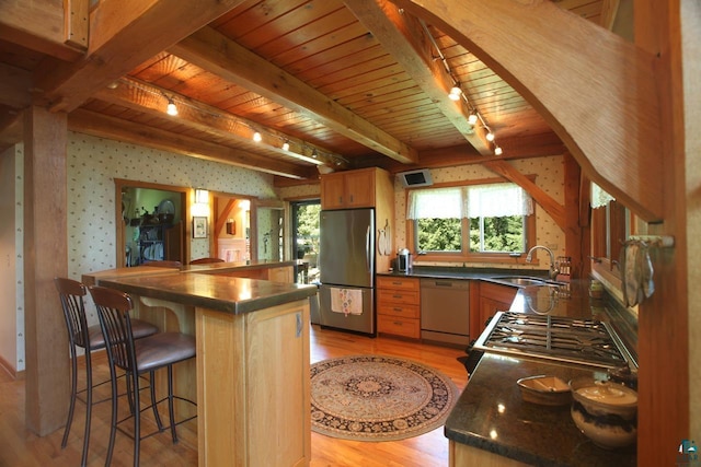 kitchen featuring sink, dishwasher, stainless steel refrigerator, and wood ceiling