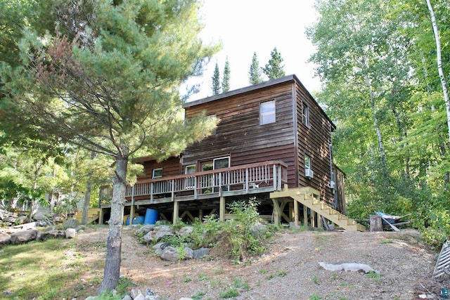 rear view of house with a wooden deck