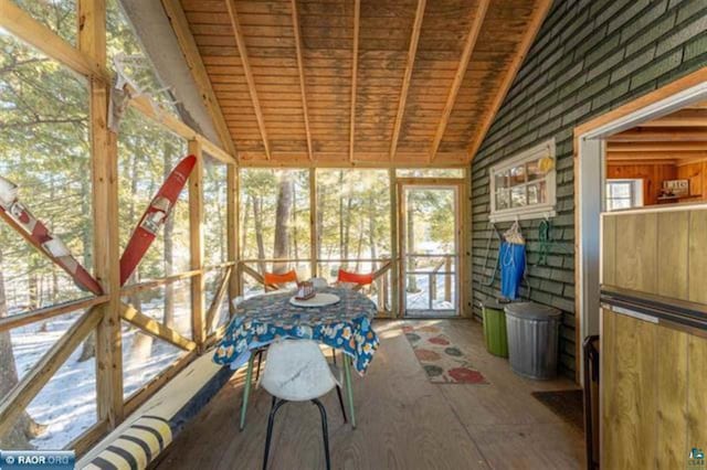 unfurnished sunroom featuring wooden ceiling and vaulted ceiling