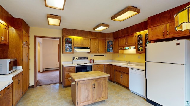 kitchen featuring light tile floors, a baseboard radiator, white appliances, and sink