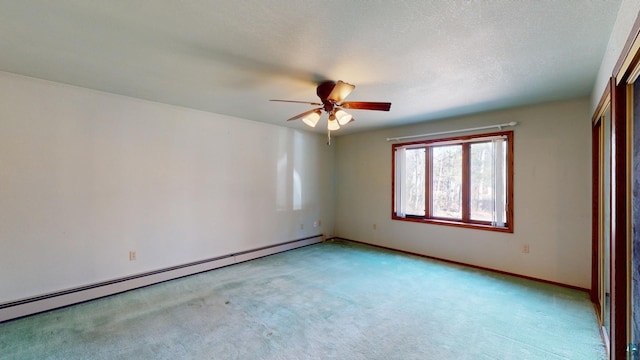 spare room with light colored carpet, ceiling fan, a textured ceiling, and a baseboard radiator