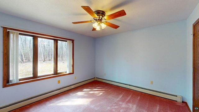 carpeted spare room featuring a healthy amount of sunlight, ceiling fan, and a baseboard radiator