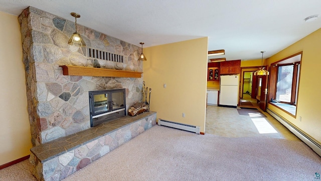 living room featuring light colored carpet, a baseboard radiator, and a fireplace