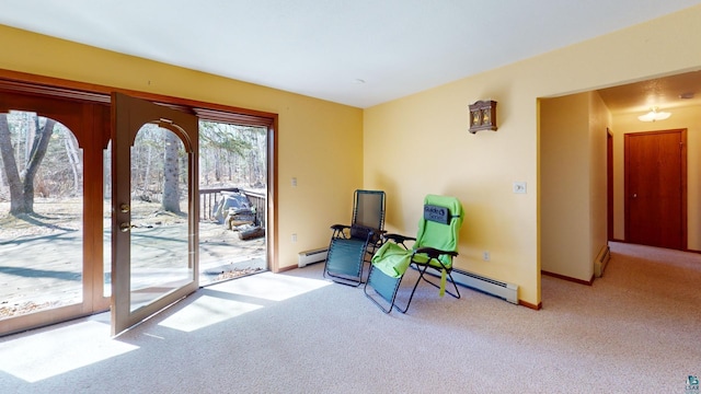 interior space featuring light colored carpet and a baseboard radiator