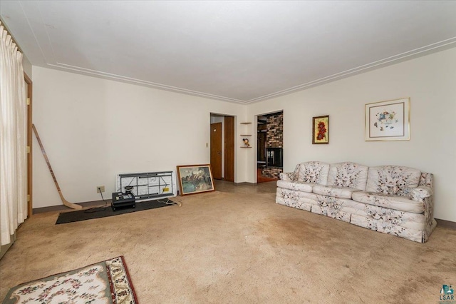 carpeted living room with ornamental molding, a fireplace, and brick wall