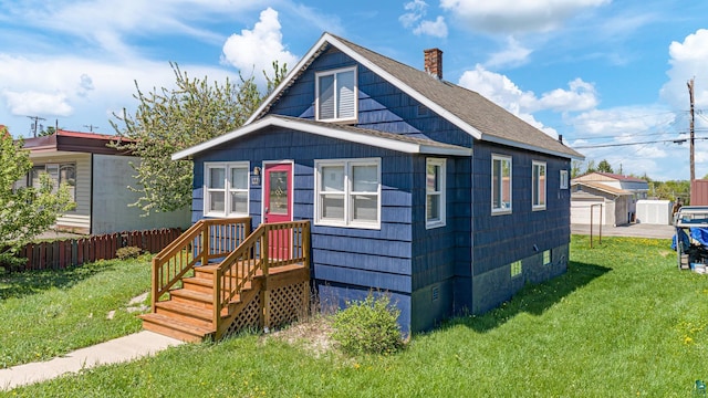 bungalow-style house with a front yard