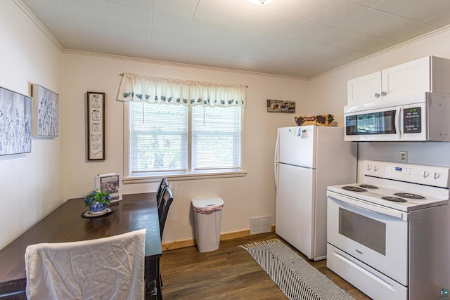 kitchen featuring crown molding, dark hardwood / wood-style flooring, white cabinets, and white appliances